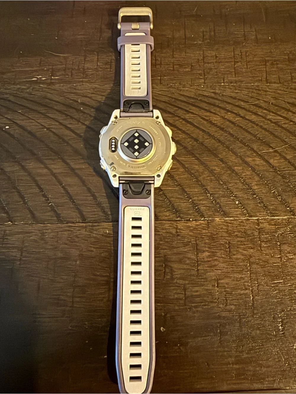 garmin Fēnix 8 smartwatch with purple strap - AMOLED display
